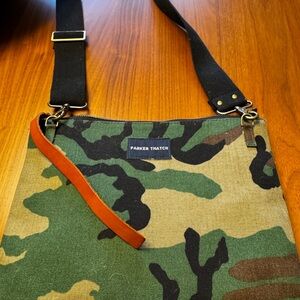 Camo with pink and red stripe. Used once. Crossover body bag by Parker Thatch.